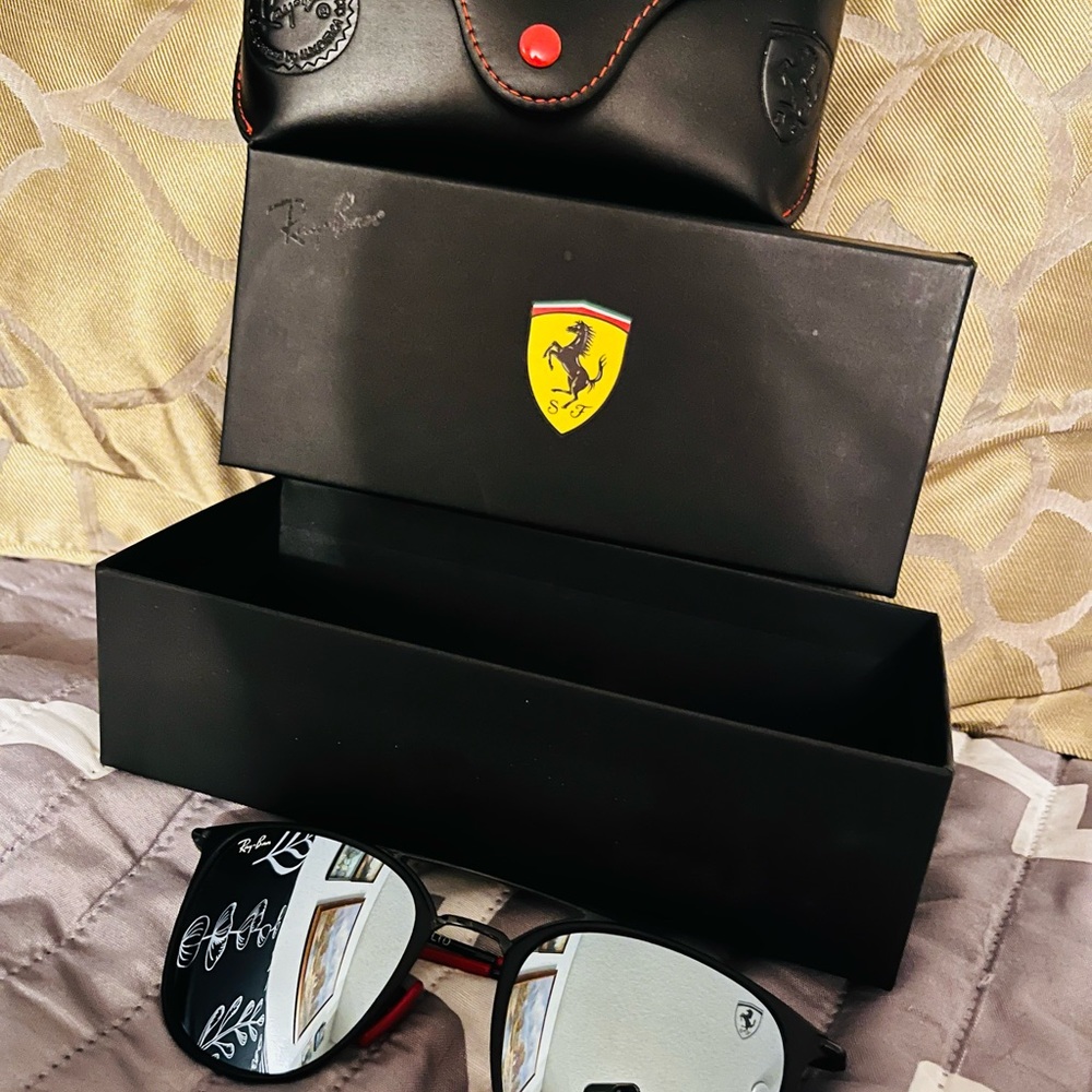 Ferrari sunglasses never worn just need them gone have no use for them !